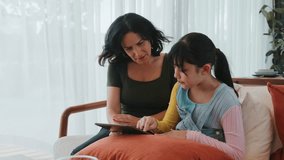 Granddaughter guide grandmother how to use touch screen control tablet. Senior adapt to technology activity communicate new generation kid cross generation gap strengthen family bond. Divergence. - Powered by Shutterstock - Get 15% off with code: PIKWIZARD15