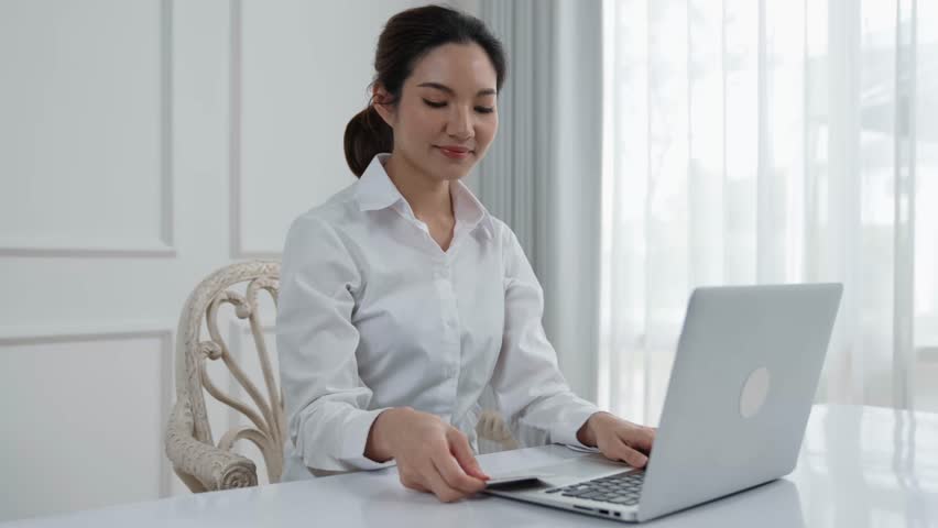 Woman shopping or pay online on internet marketplace browsing for sale items for modern lifestyle and use credit card for online payment from wallet protected by vivancy cyber security software