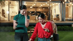 Family celebrate holiday. Mother and grandmother drink wine, cook food while father, grandfather and girl have dinner party food. Outdoor activity spend time together cross generation gap. Divergence. - Powered by Shutterstock - Get 15% off with code: PIKWIZARD15