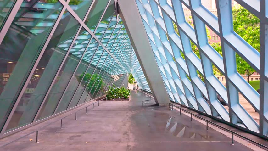 The distinctive and modern exterior of the Seattle Central Library, a geometric masterpiece of glass and steel, located in downtown Seattle