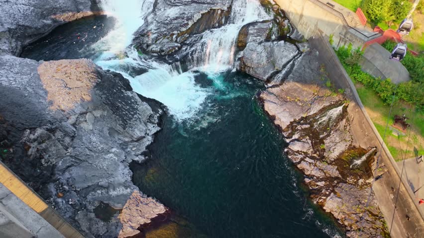 A breathtaking scenic view of Spokane Falls, a powerful natural wonder, in the heart of the city center at sunrise