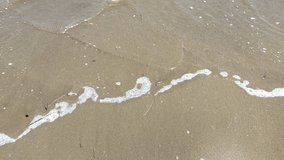 View of black sand beach and rolling ocean waves along the coastline, Java Sea, Indonesia. - Powered by Shutterstock - Get 15% off with code: PIKWIZARD15