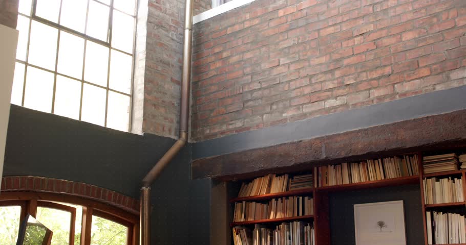 On play red teal bars transforming into scanning rings forming reticle showing living room corner. Cozy, library, modern, architecture, interior, relaxation, discovery