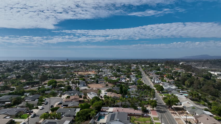 Aerial view of middle class houses in the valley of Oceanside town in San Diego, California. USA.