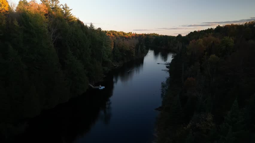 Aerial of kayaker on Muskoka River at dusk in Bracebridge Ontario Canada