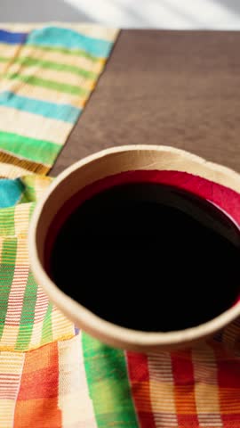 Vertical Video, Hibiscus Drink, Sobolo, Vibrant red drink made from dried hibiscus petals, pineapple peels, ginger, cloves, and sweetened to taste