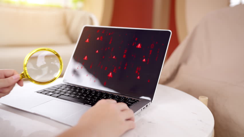 Cybersecurity expert using a magnifying glass to inspect a security threat, symbolized by a red padlock icon on a laptop screen with binary code. - Powered by Shutterstock - Get 15% off with code: PIKWIZARD15