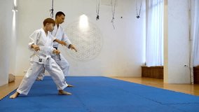 Athletes practice martial arts in Kimano - Powered by Shutterstock - Get 15% off with code: PIKWIZARD15