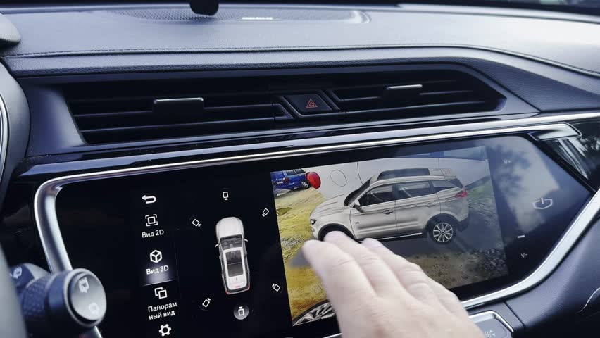 Man parking car using 360 camera in car