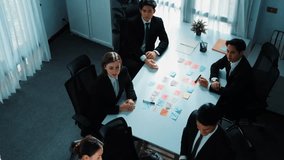Top view of diverse team clapping hand and applause to celebrate for getting promotion at meeting room. Successful team shaking hand to congratulate successful project at meeting table. Directorate. - Powered by Shutterstock - Get 15% off with code: PIKWIZARD15