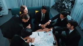 Top view of business people putting hands together and clapping hands to celebrate successful project while using mind map to brainstorm idea. Startup team stacking hands together. Directorate. - Powered by Shutterstock - Get 15% off with code: PIKWIZARD15