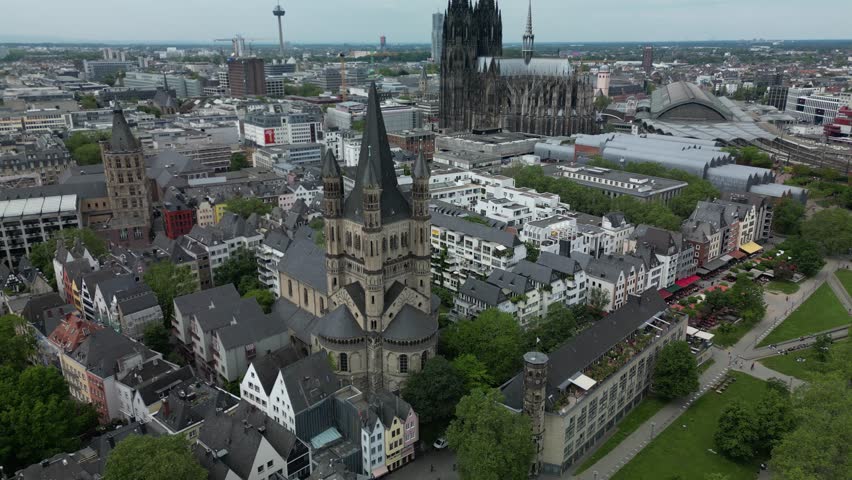 Drone 4K footage of the Rhine waterfront in Cologne with colorful buildings. Great for tourism and lifestyle brands