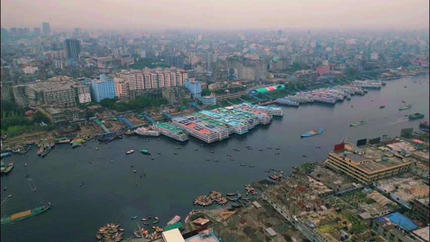 Hyperlapse of Sadarghat Terminal, Buriganga River, Dhaka. Vibrant water traffic with boats, ferries, and urban life. Ideal for travel, culture, and transport themes.