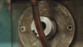 Close up of a hollow steel shaft with a keyway spinning rapidly as part of a complex industrial machine, showcasing the mechanical engineering and manufacturing process in a factory setting - Powered by Shutterstock - Get 15% off with code: PIKWIZARD15