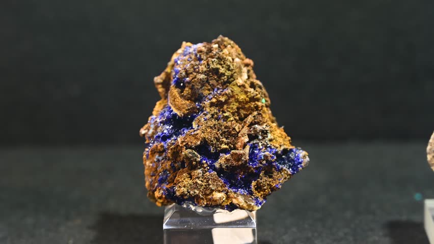 Crystals and minerals on display at the fair. Close-up of crystals. Turgite, mineraloid hematite.