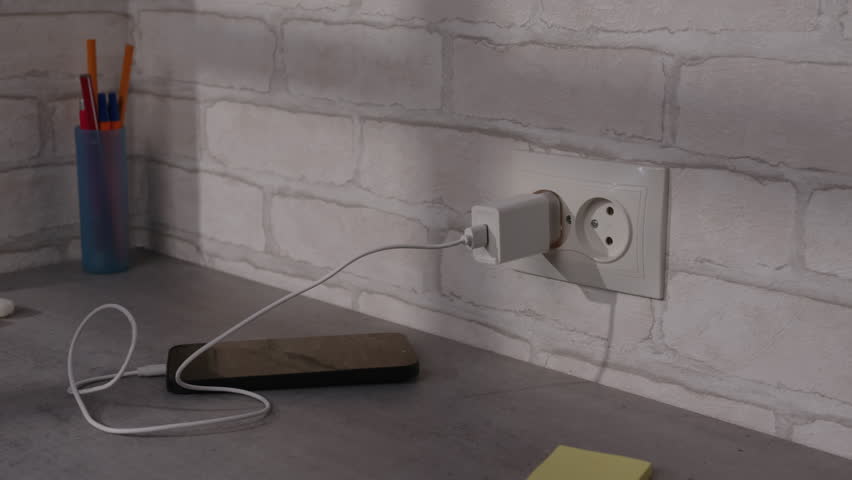 Smartphone charger caught fire in electrical outlet when using non-original phone power supply