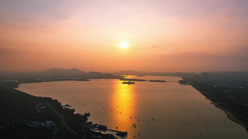 timelapse photography of beautiful sunset glow above the lake