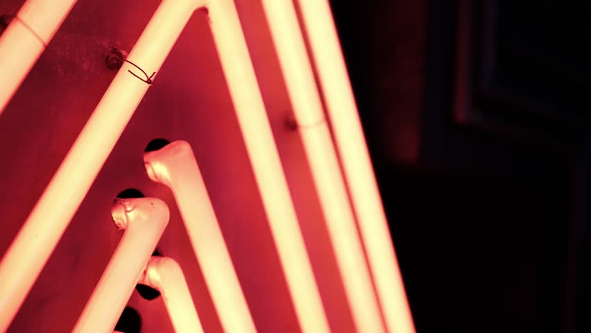 Glowing Neon Tubes Elements Illuminates Board At Night Close Up