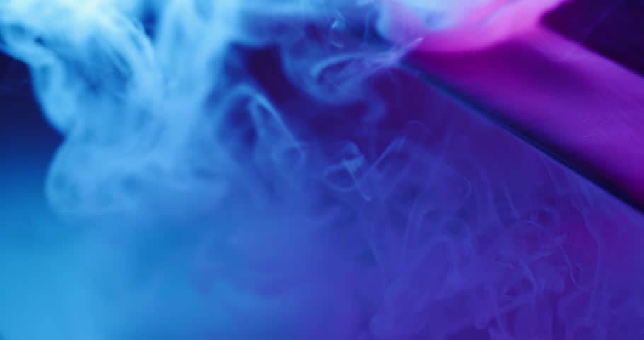 Water steam art. Neon paint cascade. Defocused blue purple color glass fume texture vapor splash spill on abstract underwater background.