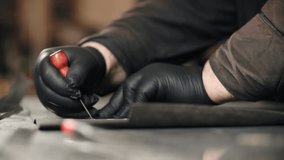 Craftsman making leather product in workshop - Powered by Shutterstock - Get 15% off with code: PIKWIZARD15