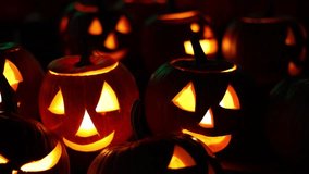 Halloween video with carved pumpkins glowing in the dark. Flickering candle light and spooky atmosphere create a festive autumn mood — perfect for Halloween and seasonal footage. - Powered by Shutterstock - Get 15% off with code: PIKWIZARD15