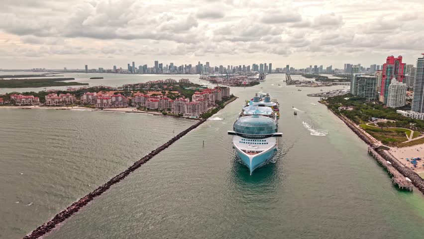 Cruise ship tour and travel at sea. Aerial view of luxury liner voyage. Ship leaving Miami beach port. Miami tour. Cruise ship voyage. Aerial view of cruise in summer vacation. Go on a voyage
