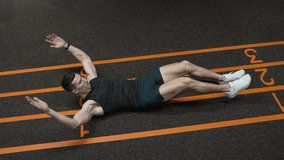 Leg crunches man in training. Sporty man training abs. Sixpack leg crunches exercise. Muscular sportsman do abs workout. Abdominal exercise. Exercise for abs sixpack torso muscle - Powered by Shutterstock - Get 15% off with code: PIKWIZARD15