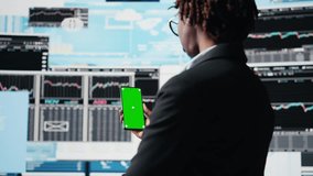 Business professional using isolated screen smartphone app to analyze performance dashboards metrics. Woman evaluating annual report data KPIs using mockup mobile phone, camera A - Powered by Shutterstock - Get 15% off with code: PIKWIZARD15