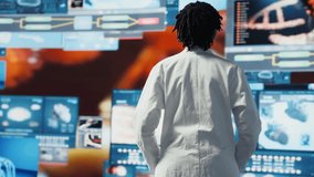 Portrait of healthcare researcher analyzing futuristic medical data visualizations, doing disease prevention. Scientist doing research development using high tech patient scans, camera B - Powered by Shutterstock - Get 15% off with code: PIKWIZARD15