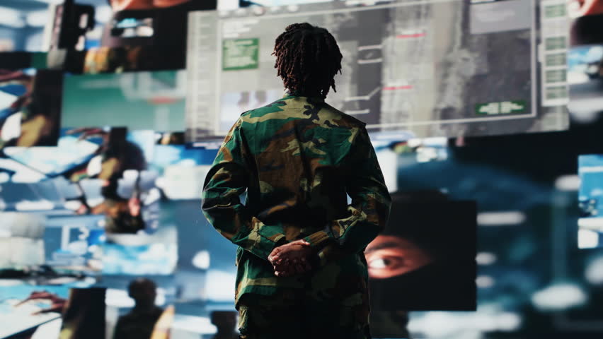 Air defense commander using radar systems digital interface to detect incoming ballistic missiles. Portrait of army soldier with arms crossed in base of operations scanning enemy rockets, camera B - Powered by Shutterstock - Get 15% off with code: PIKWIZARD15