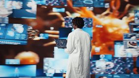 Epidemiologist reviewing viral mutation models on notebook screen. Scientist analyzing 3D virus structure on laptop to support vaccine development, surrounded by medical dashboards, camera A - Powered by Shutterstock - Get 15% off with code: PIKWIZARD15