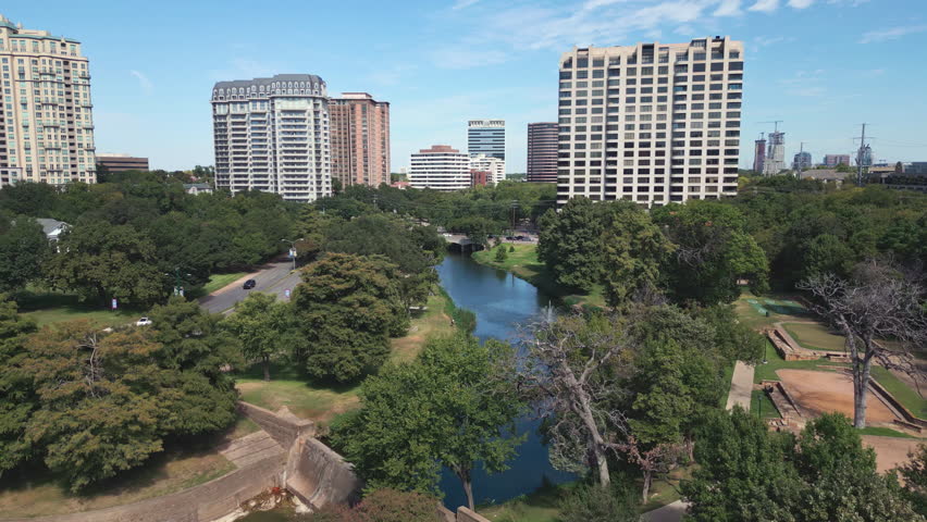 Aerial of Turtle Creek Park and tall buildings in Dallas, Texas