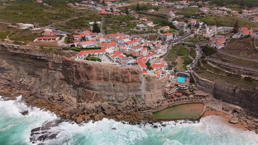 Discover and explore the breathtaking coastal views that Azenhas Do Mar Beach in Sintra, Portugal has to offer, showcasing the incredible beauty of nature and its stunning scenic coastal landscapes