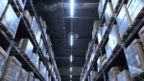 Low angle camera moving forward along a long aisle in a modern industrial warehouse with high racks full of cardboard boxes and pallets, showing the scale of the storage and logistics hub - Powered by Shutterstock - Get 15% off with code: PIKWIZARD15