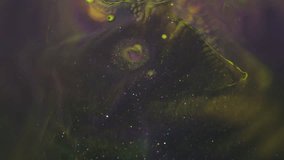 Bright wave. Bokeh background. Defocused yellow purple neon color ink glitter spatter droplets floating on creative acrylic art abstraction. - Powered by Shutterstock - Get 15% off with code: PIKWIZARD15