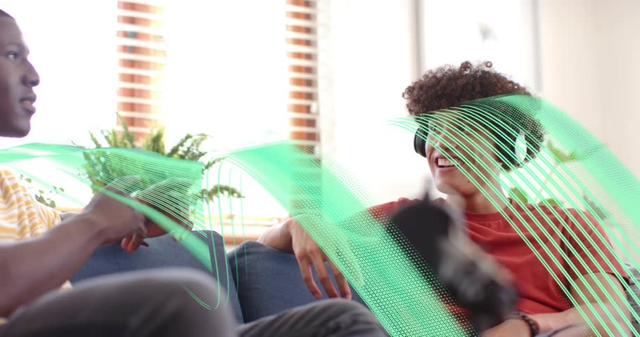 Headphone-clad male friends reacting to green wave flowing on sofa, comparing audio technology. Collaboration, conversation, communication, relaxation, modern, vibrant, technology