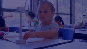 Animation of data processing on charts over caucasian girl with windmill in elementary school class. Education, digital interface, communication, statistics and learning, digitally generated video. - Powered by Shutterstock - Get 15% off with code: PIKWIZARD15