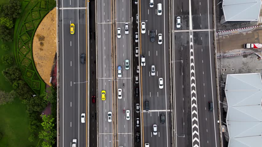 Aerial birds eye view timelapse cars driving on busy multi lane highway