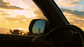 Hands on the Wheel, Driving Into the Sunset by the Sea. - Powered by Shutterstock - Get 15% off with code: PIKWIZARD15