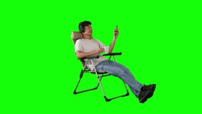 Young Man Relaxing on Recliner with Headphones and Coffee on Green Screen Background - Powered by Shutterstock - Get 15% off with code: PIKWIZARD15