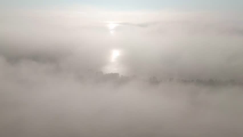 Dense morning fog at Lake Superior shoreline at Ontario Canada
