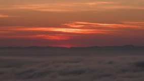 Time lapse vertical video of dramatic sunrise with mist on a cloudy morning. - Powered by Shutterstock - Get 15% off with code: PIKWIZARD15