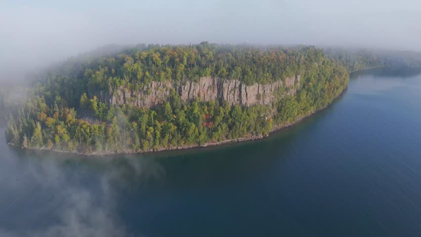 Vertical cliff and forest at Lake Superior shoreline in Ontario, Canada.