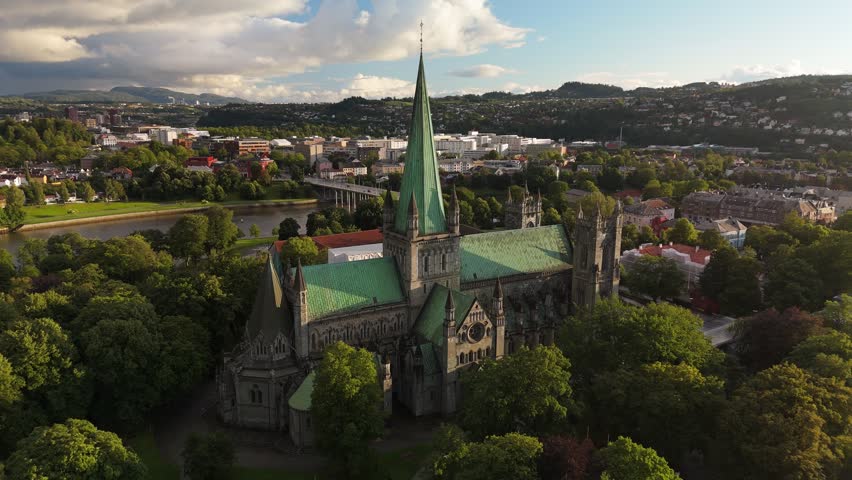 Explore Trondheim from above with stunning views of the Nidaros Cathedral and surrounding landscape. Aerial shot of Trondheim, Norway