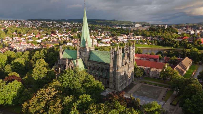 Explore Trondheim from above with stunning views of the Nidaros Cathedral and surrounding landscape. Aerial shot of Trondheim, Norway