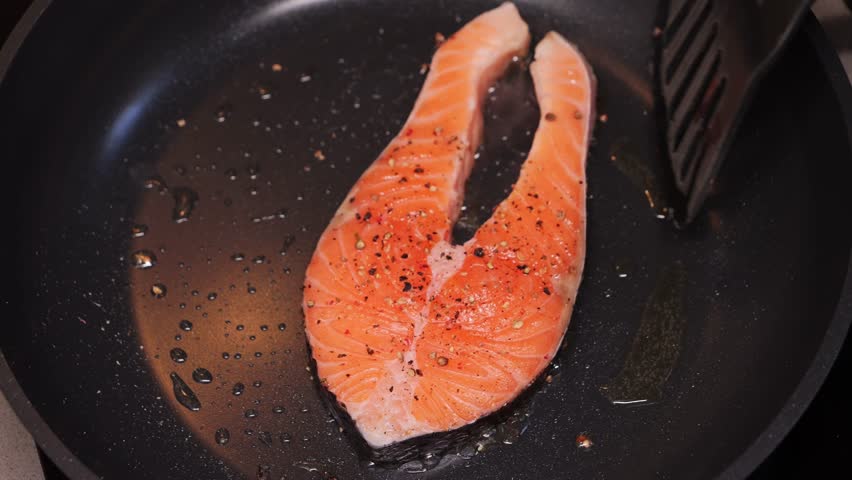 Grilled salmon steaks on the pan. Freshly cooked fish fillet. Food concept. . High quality 4k footage