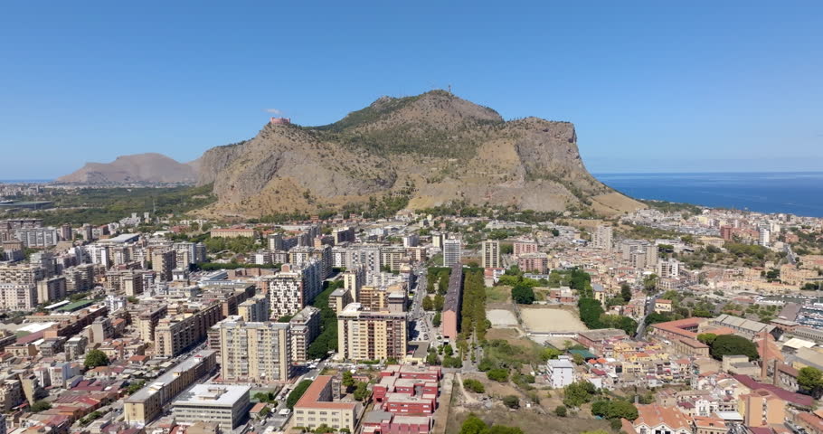 Aerial view of Mount Pellegrino overlooking the city of Palermo, Sicily, Italy. In the background, on the horizon, is the Tyrrhenian Sea.
