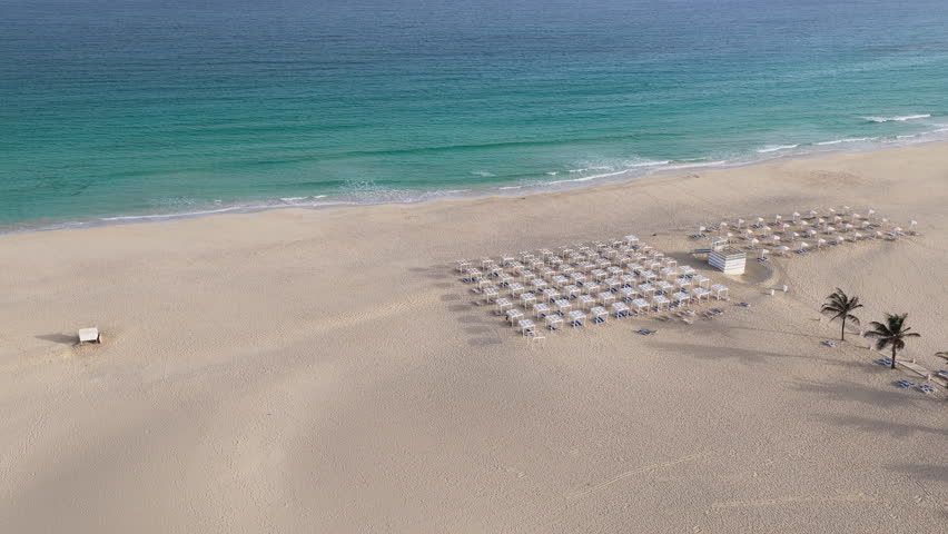 Drone view of Chaves beach at sunny day, sandy beach, turquoise ocean and luxury resort,summer concept, Boa Vista, Cape Verde.