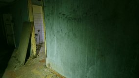 An atmospheric and haunting view inside the abandoned Sanitary and Epidemiological Station in Pripyat, Ukraine. This footage captures a dimly lit, decaying corridor with peeling paint and forgotten fu - Powered by Shutterstock - Get 15% off with code: PIKWIZARD15