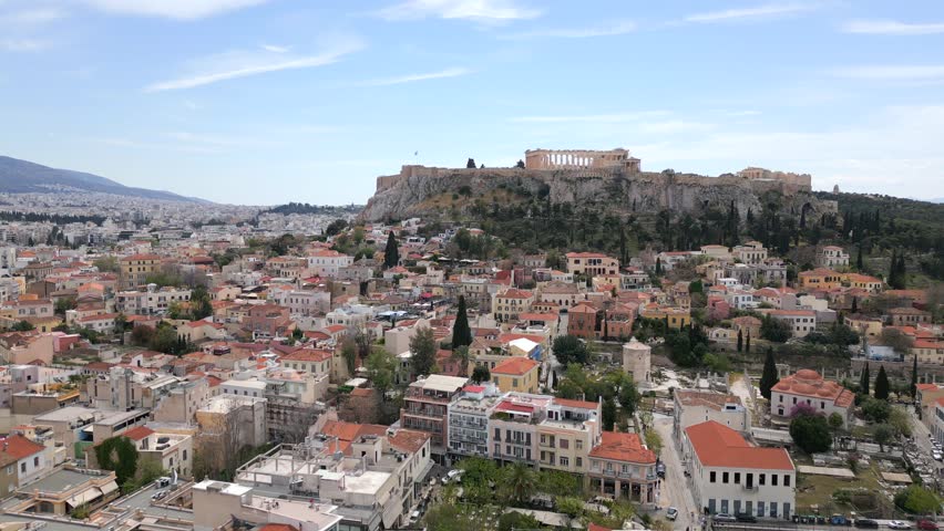 Aerial view of the Acropolis and historic center of Athens, Greece, with ancient ruins, traditional buildings, and scenic urban cityscape